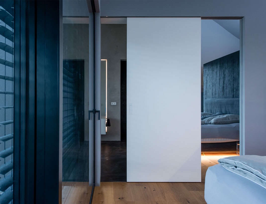 Modern bedroom pivot door interior view