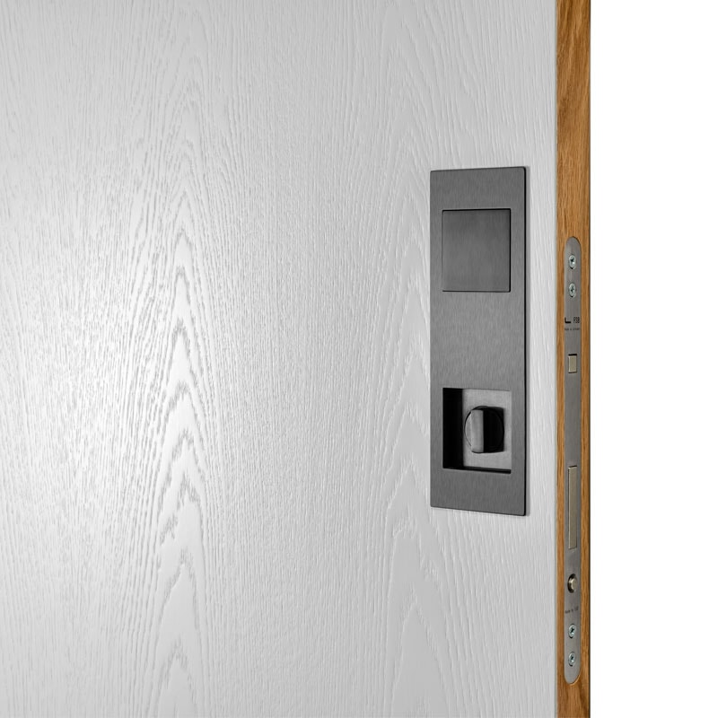 Pocket door open to wardrobe with clothing rack