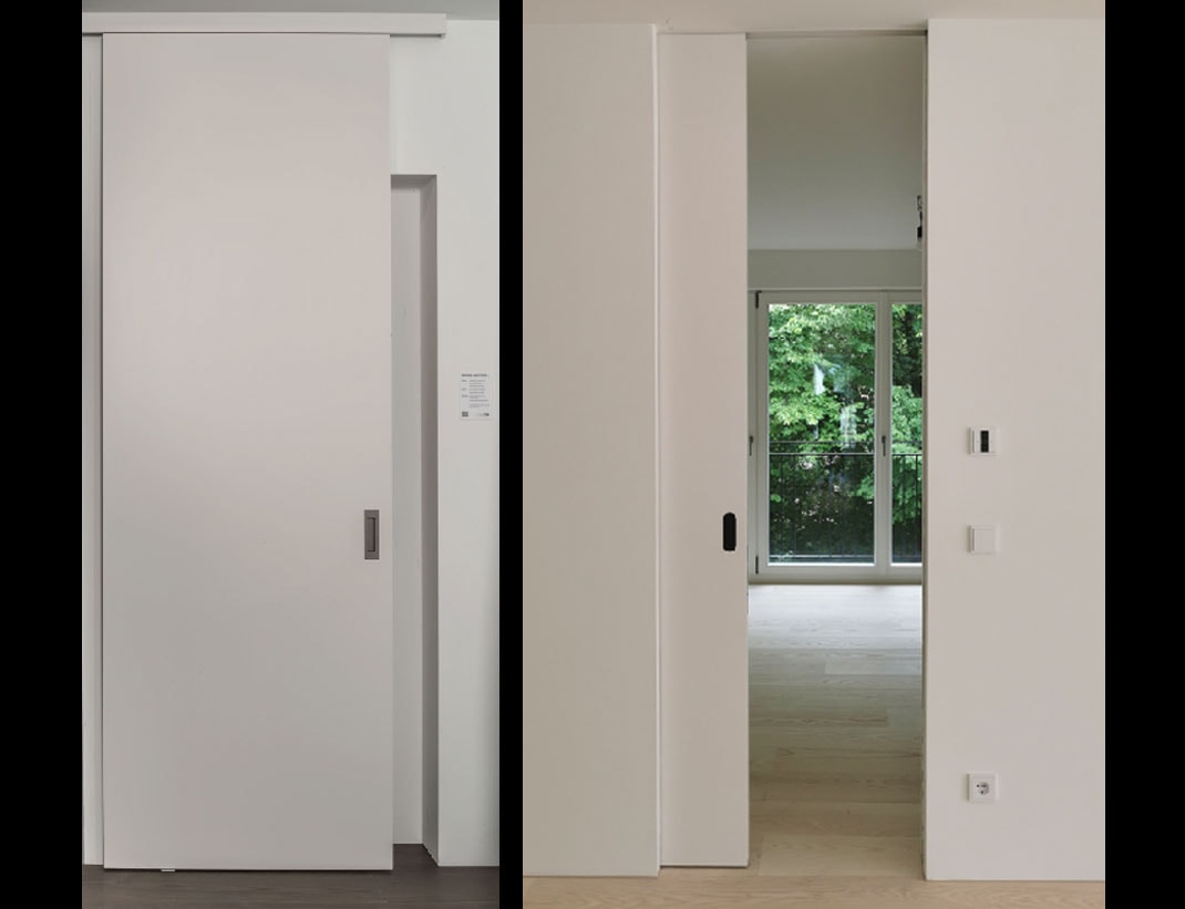 Pocket door with oval flush pull hardware detail